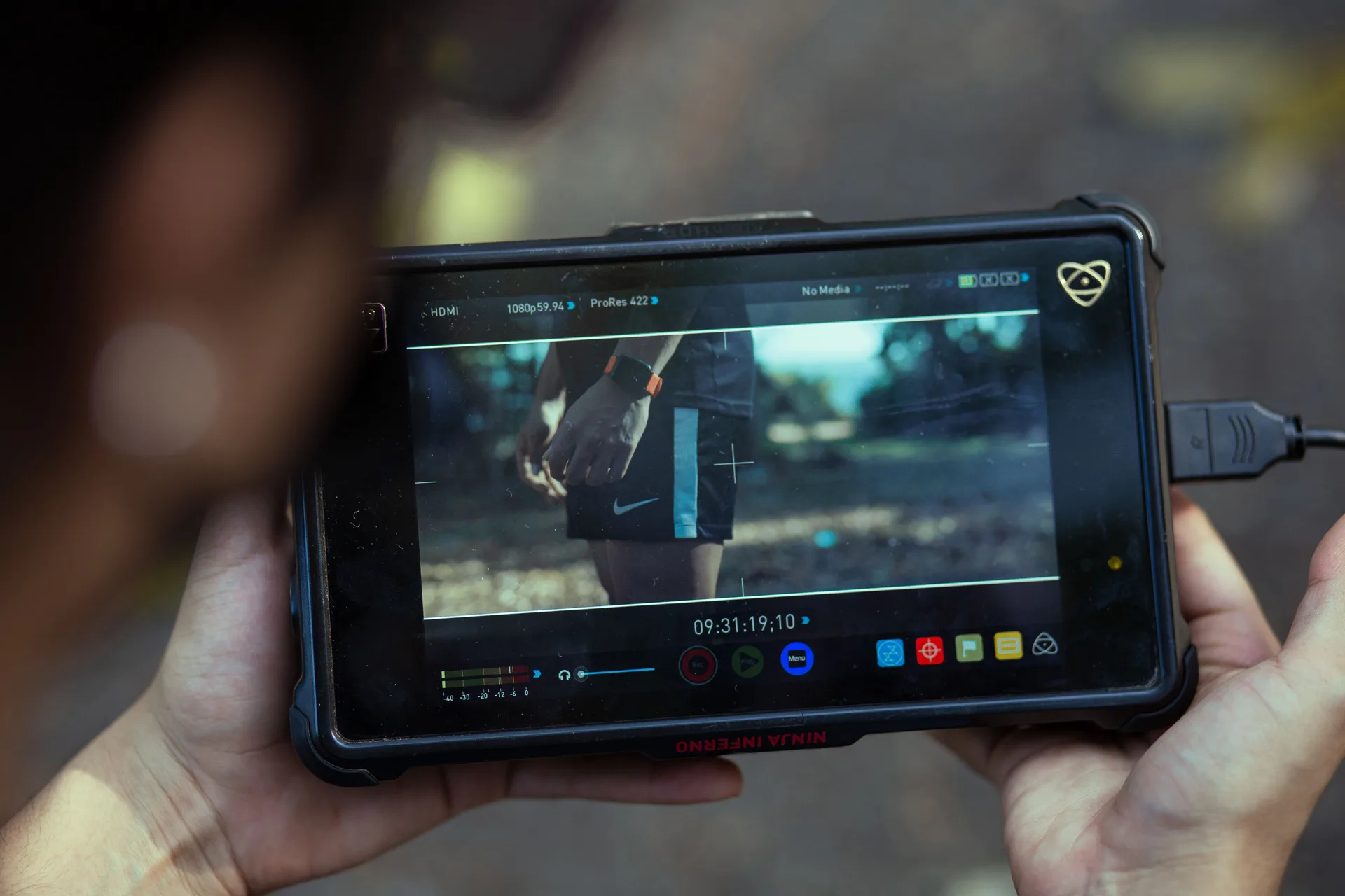 External video monitor displaying a paused frame from recorded footage